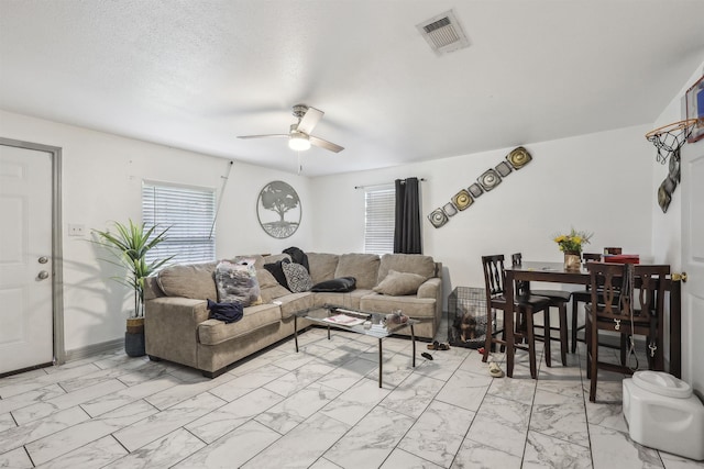 2725 29th St, Port Arthur, TX 77640 - living area with light marble finish floors and ceiling fan