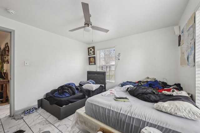 2725 29th St, Port Arthur, TX 77640 - bedroom featuring light marble finish flooring and a ceiling fan