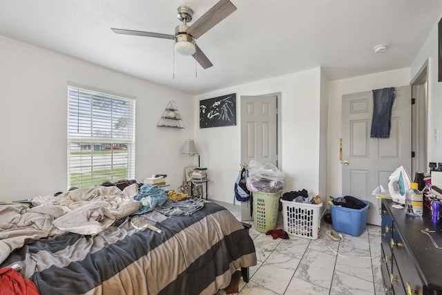 2725 29th St, Port Arthur, TX 77640 - bedroom with light marble finish floors and a ceiling fan