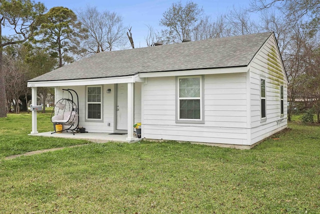 2725 29th St, Port Arthur, TX 77640 - view of front of house featuring roof with shingles and a front yard