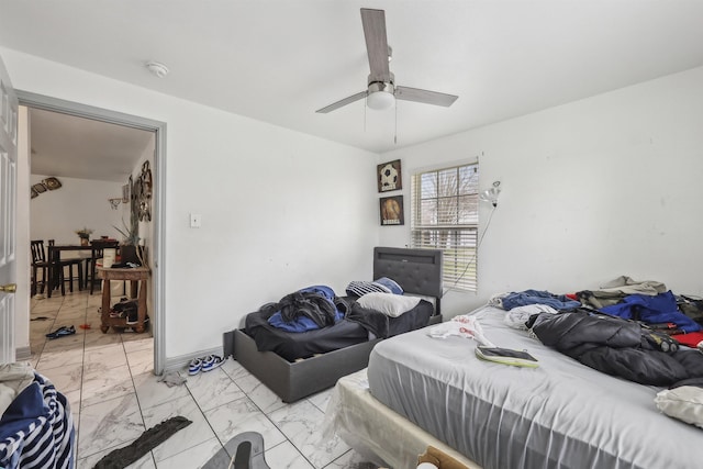 2725 29th St, Port Arthur, TX 77640 - bedroom with light marble finish floors and ceiling fan