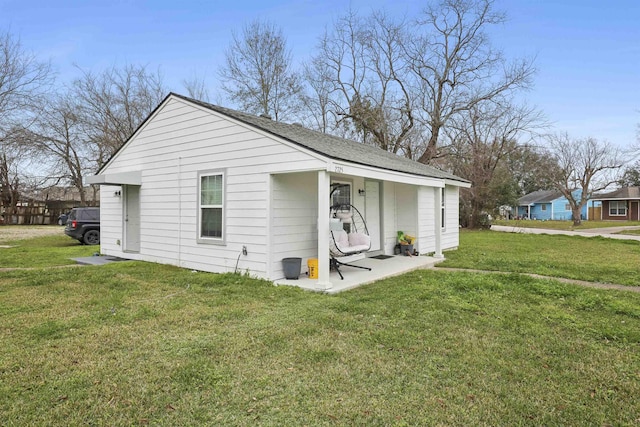 2725 29th St, Port Arthur, TX 77640 - view of front of house with a front lawn and a shingled roof