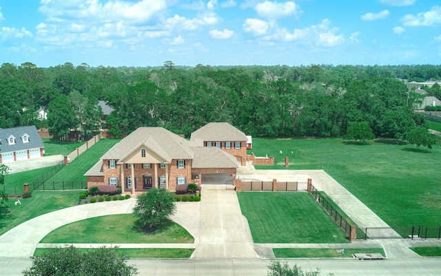 2250 Savannah Trce, Beaumont, TX 77706 - view of front of home with curved driveway, a garage, and brick siding