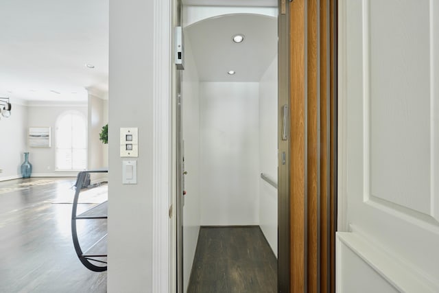 2250 Savannah Trce, Beaumont, TX 77706 - hallway with dark wood-style flooring, ornamental molding, recessed lighting, and elevator