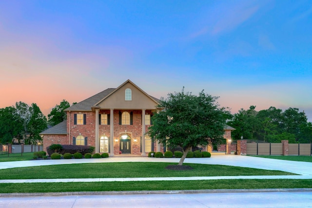 2250 Savannah Trce, Beaumont, TX 77706 - greek revival house with curved driveway and brick siding