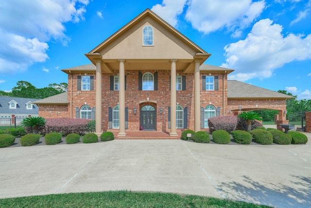 2250 Savannah Trce, Beaumont, TX 77706 - neoclassical home featuring brick siding