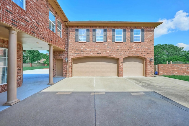 2250 Savannah Trce, Beaumont, TX 77706 - view of front of property featuring a garage, concrete driveway, and brick siding