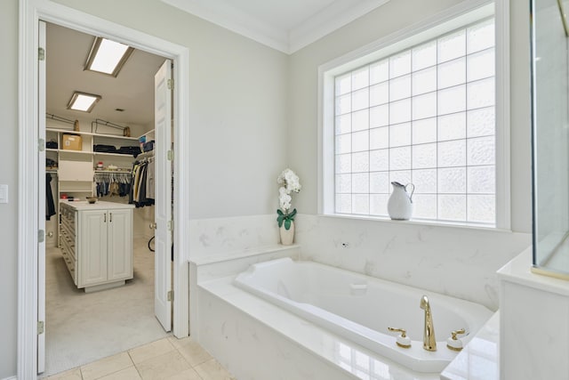 2250 Savannah Trce, Beaumont, TX 77706 - bathroom featuring a bath, healthy amount of natural light, a walk in closet, tile patterned floors, and crown molding
