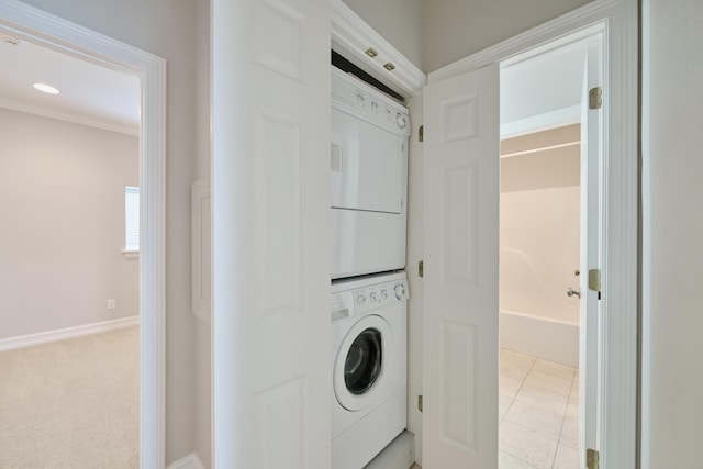 2250 Savannah Trce, Beaumont, TX 77706 - washroom with stacked washer and clothes dryer and baseboards