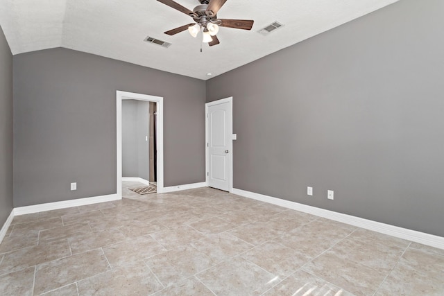 spare room with ceiling fan and lofted ceiling