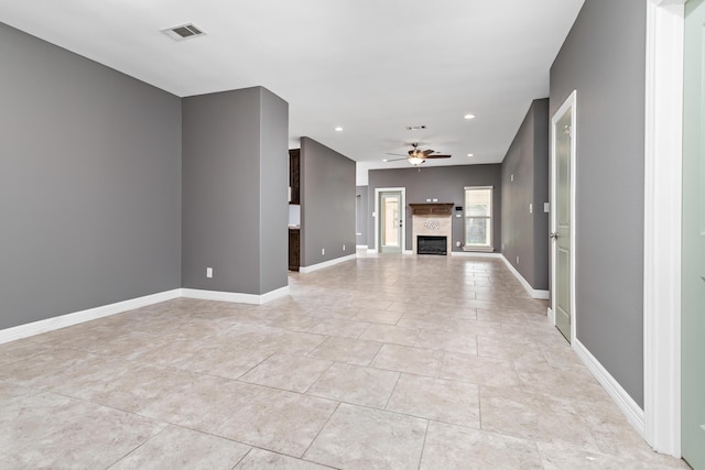 12715 Koawood Ln, Beaumont, TX 77713 - unfurnished living room with ceiling fan, light tile patterned floors, recessed lighting, and a glass covered fireplace