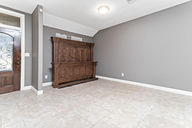 foyer entrance featuring lofted ceiling