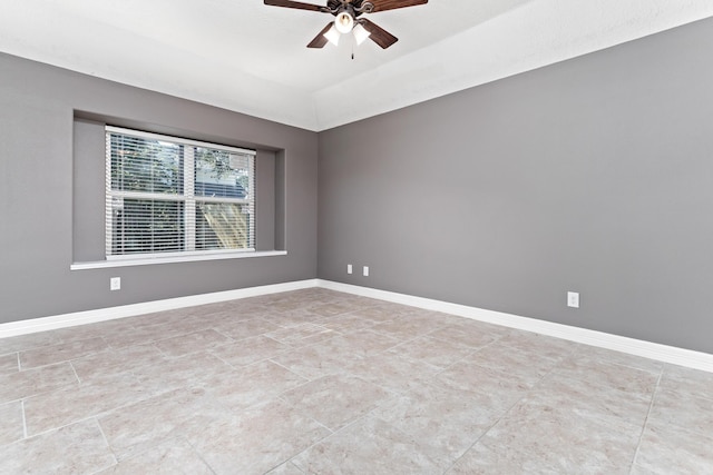 empty room featuring ceiling fan and lofted ceiling