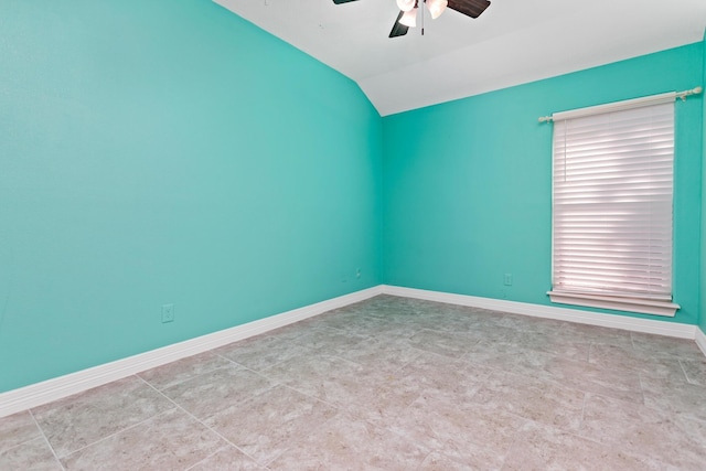 empty room featuring ceiling fan and vaulted ceiling