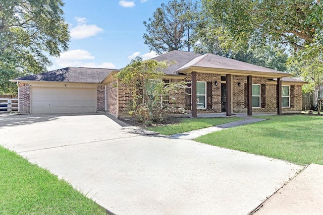 ranch-style house featuring a garage and a front lawn