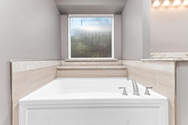 12715 Koawood Ln, Beaumont, TX 77713 - full bathroom with a bath and a textured wall