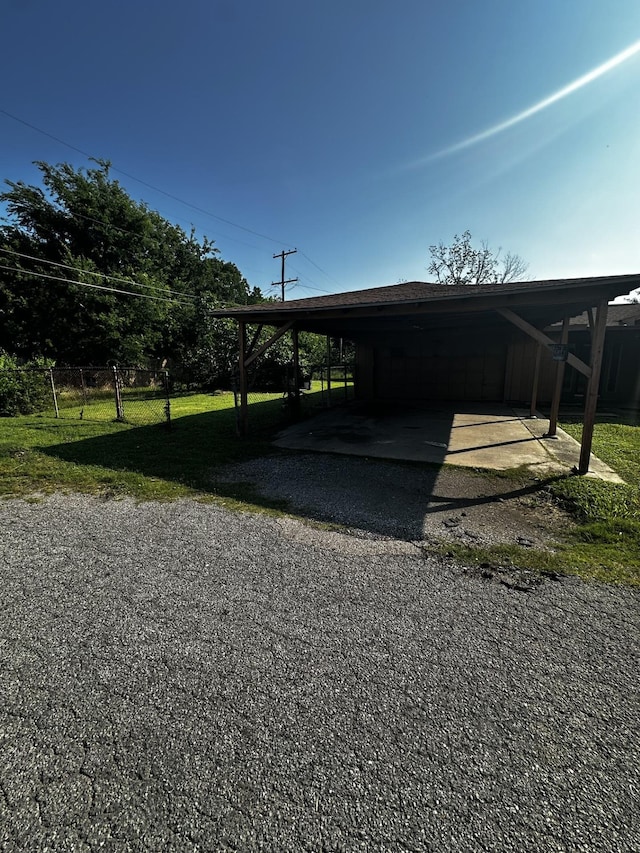 1901 14th St, Port Arthur, TX 77640 - view of car parking with driveway and an attached carport
