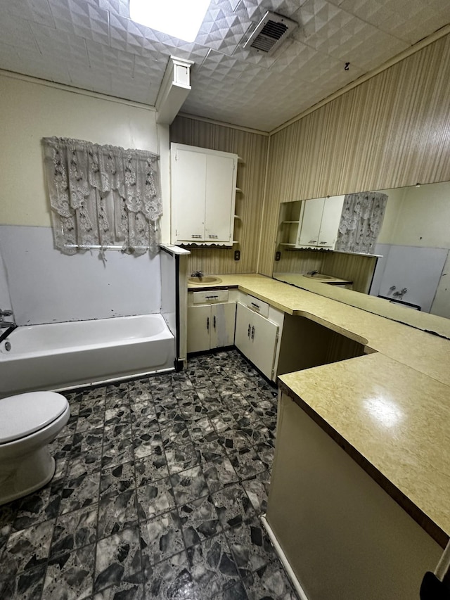 1901 14th St, Port Arthur, TX 77640 - kitchen with open shelves, light countertops, white cabinets, and a sink
