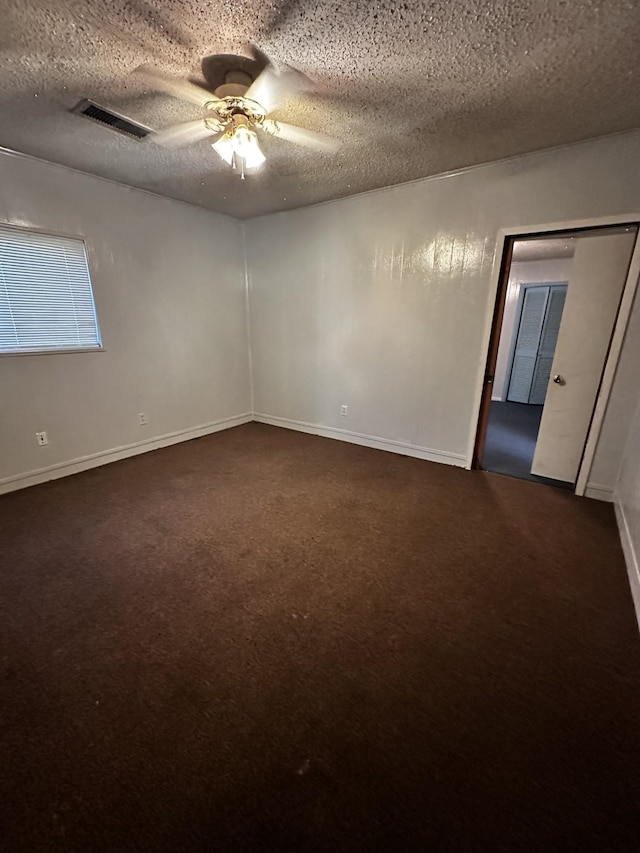 1901 14th St, Port Arthur, TX 77640 - unfurnished room featuring dark carpet, a ceiling fan, a textured ceiling, and baseboards