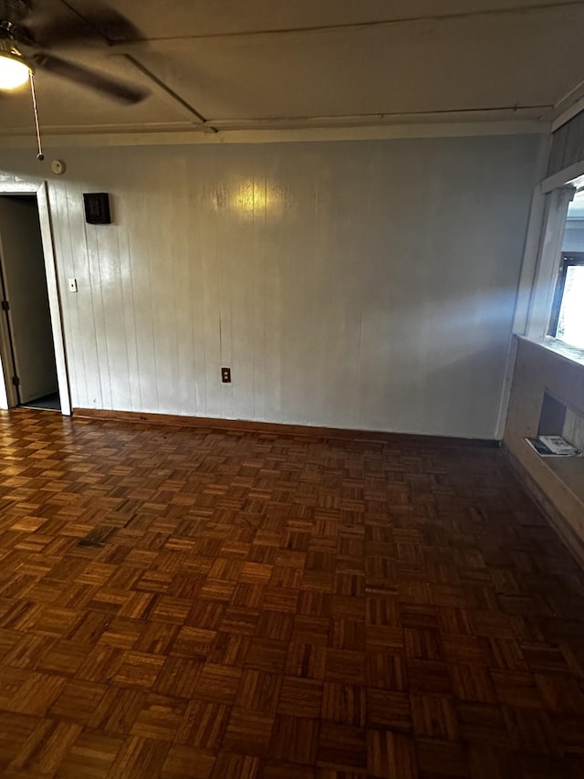 1901 14th St, Port Arthur, TX 77640 - spare room with baseboards, a ceiling fan, and wood walls