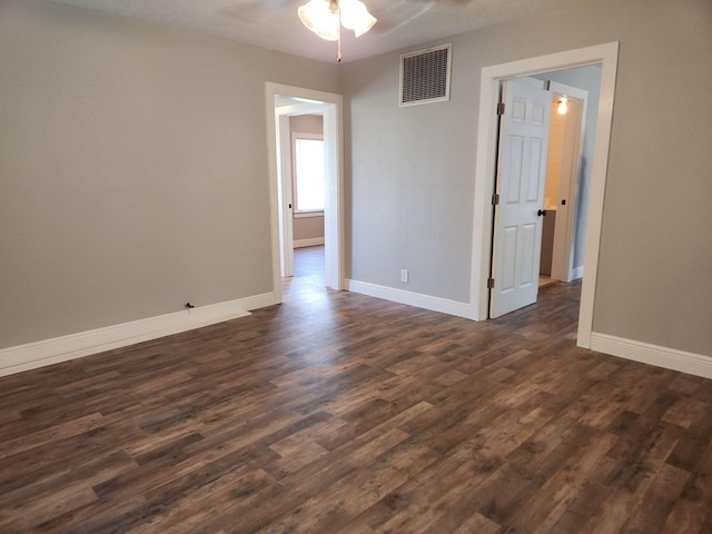 1313 Block St, Port Neches, TX 77651 - empty room with dark wood-style floors, baseboards, and a ceiling fan