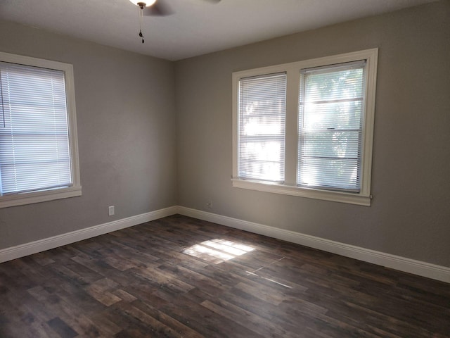 1313 Block St, Port Neches, TX 77651 - unfurnished room with dark wood-type flooring, baseboards, and ceiling fan
