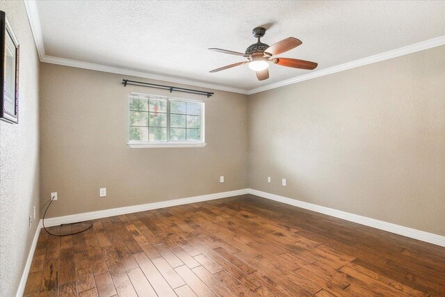 unfurnished room with ceiling fan, dark hardwood / wood-style flooring, a textured ceiling, and ornamental molding