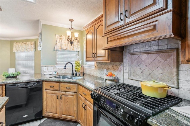 kitchen with light stone countertops, backsplash, ornamental molding, sink, and black appliances