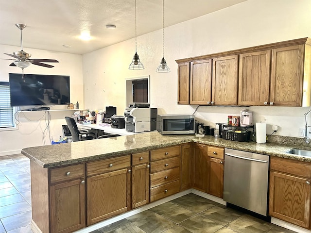 kitchen with kitchen peninsula, stainless steel appliances, ceiling fan, decorative light fixtures, and dark stone countertops