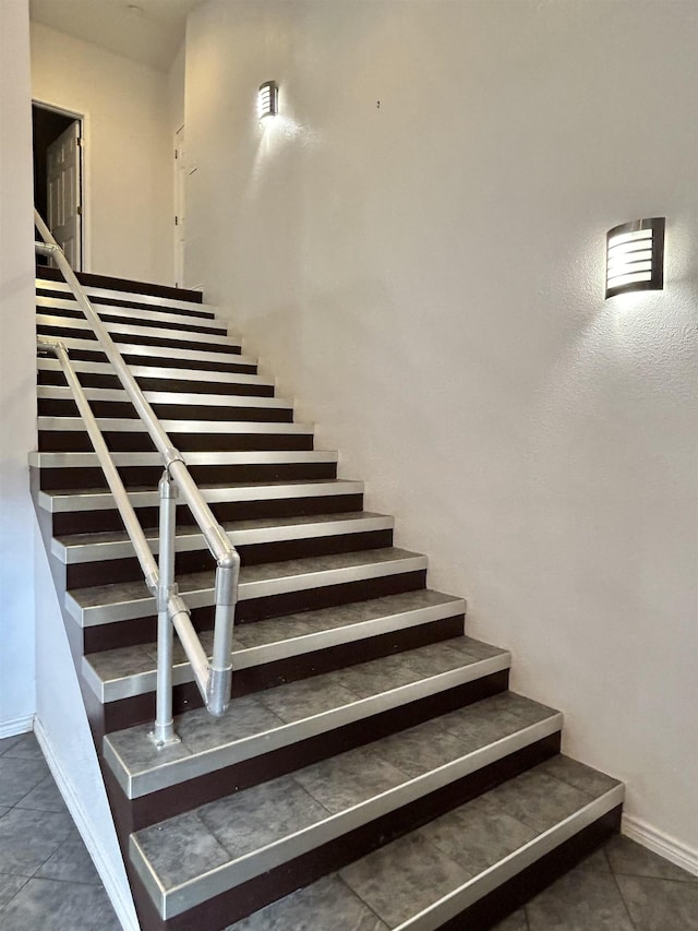 staircase with tile patterned flooring