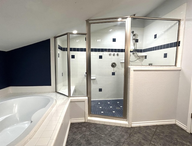 bathroom with tile patterned flooring, lofted ceiling, and shower with separate bathtub