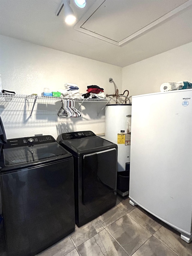 laundry room featuring separate washer and dryer, tile patterned floors, and water heater