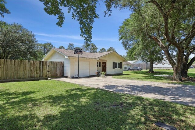 233 Spooner St, Orange, TX 77630 - single story home with an attached garage and concrete driveway
