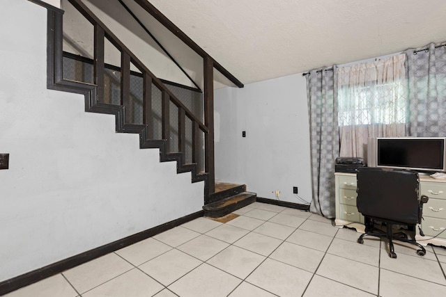 7775 River Rd, Beaumont, TX 77713 - office area featuring vaulted ceiling, light tile patterned floors, and a textured ceiling