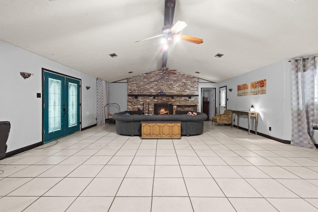 7775 River Rd, Beaumont, TX 77713 - living area featuring a fireplace, a ceiling fan, and light tile patterned floors