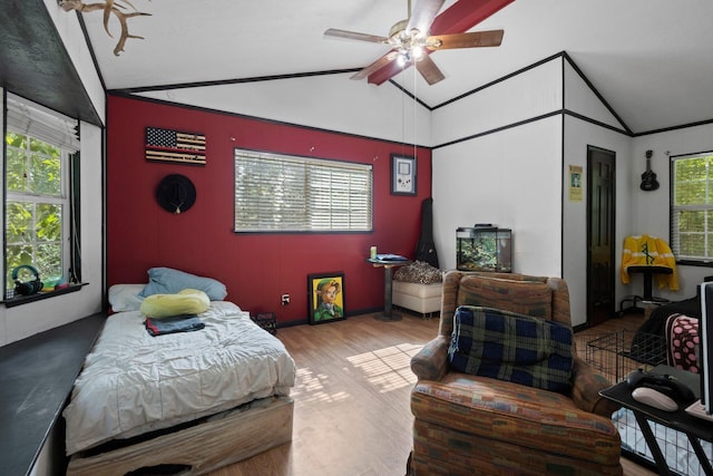 7775 River Rd, Beaumont, TX 77713 - bedroom featuring vaulted ceiling, multiple windows, wood finished floors, and ceiling fan