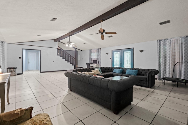 7775 River Rd, Beaumont, TX 77713 - living area featuring light tile patterned flooring, a textured ceiling, stairway, and a ceiling fan