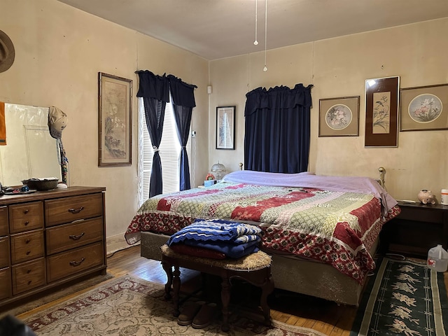 bedroom featuring hardwood / wood-style flooring