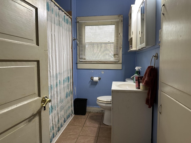 bathroom featuring tile patterned flooring, vanity, and toilet