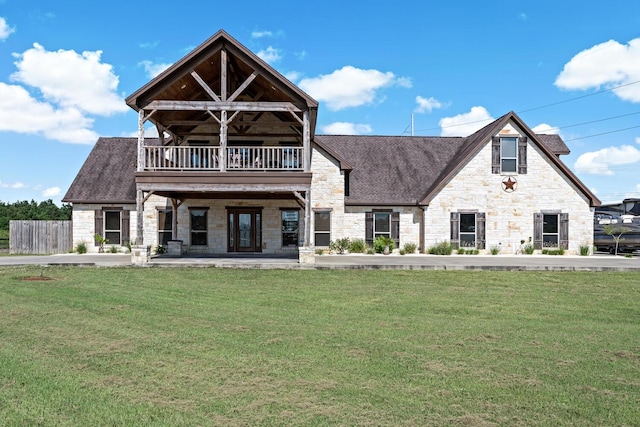 view of front of property featuring a balcony and a front lawn