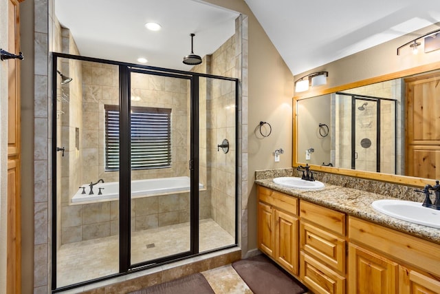 bathroom with tile patterned floors, vanity, and independent shower and bath