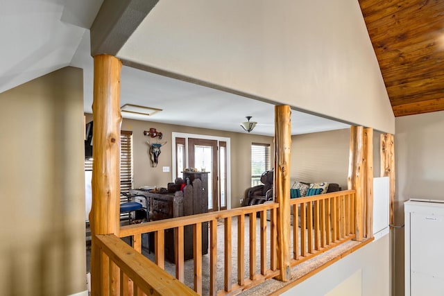 hallway featuring lofted ceiling