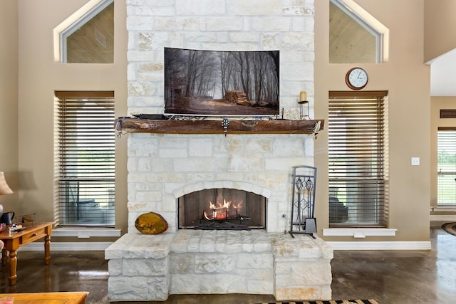 living room with a stone fireplace