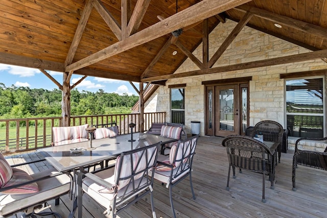 wooden terrace with french doors, an outdoor living space, and a gazebo