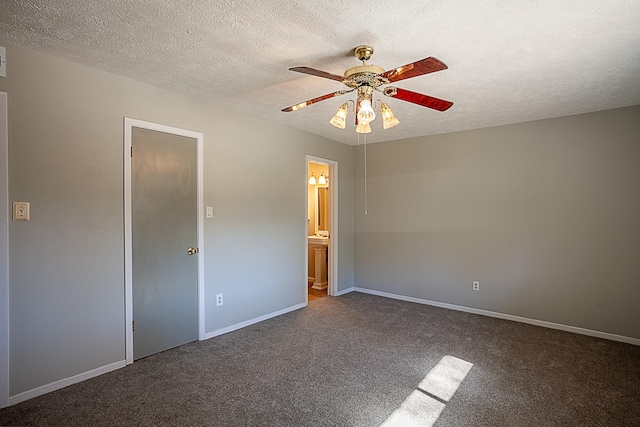 8228A Ponderosa Dr, Silsbee, TX 77656 - unfurnished bedroom featuring carpet flooring, baseboards, a textured ceiling, ensuite bathroom, and a ceiling fan