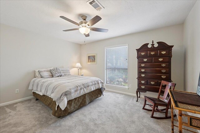 6650 Windwood Ln, Beaumont, TX 77706 - carpeted bedroom featuring baseboards, ceiling fan, and a textured ceiling