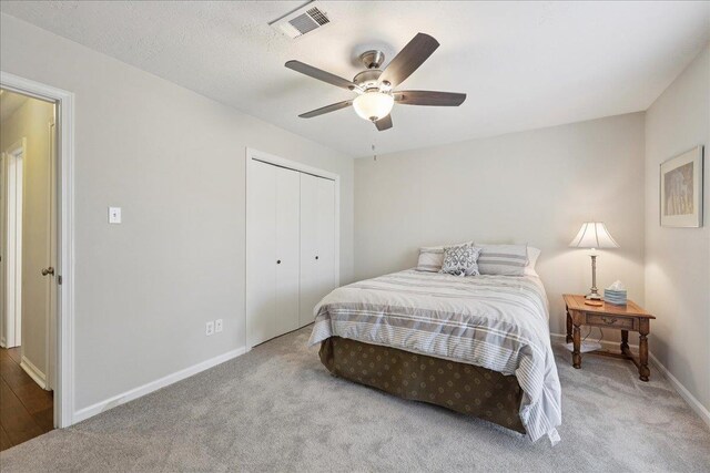 6650 Windwood Ln, Beaumont, TX 77706 - carpeted bedroom featuring baseboards, a closet, and a ceiling fan