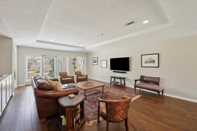6650 Windwood Ln, Beaumont, TX 77706 - living area with a raised ceiling, a textured ceiling, dark wood finished floors, baseboards, and recessed lighting