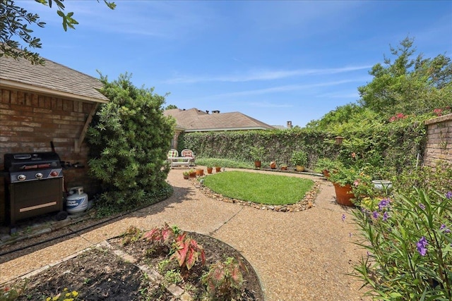 6650 Windwood Ln, Beaumont, TX 77706 - fenced backyard with a patio area