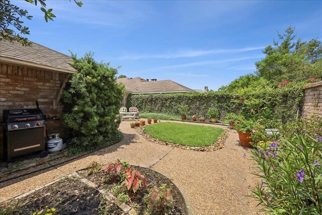 6650 Windwood Ln, Beaumont, TX 77706 - fenced backyard with a patio area